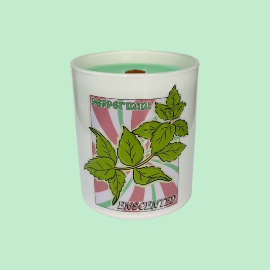 A white candle with a label showing green peppermint leaves and the text 'PEPPERMINT ENGLISH'.