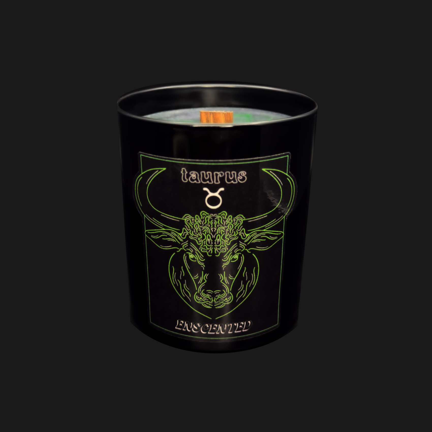A black candle with a graphic of a bull, representing the Taurus zodiac sign, and a label indicating it is a Taurus scented candle.